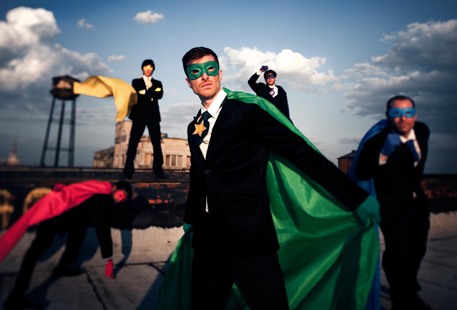 Business men dressed as superheroes
